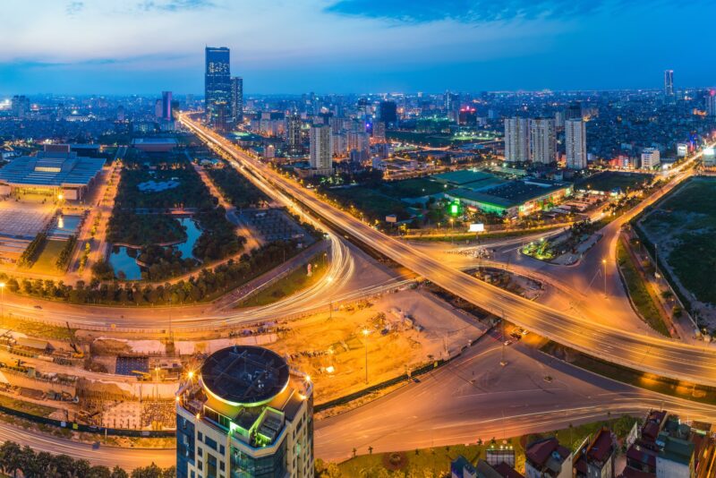 Aerial Skyline View Of Hanoi Cityscape At Twilight. Thang Long Freeway And Pham Hung Street