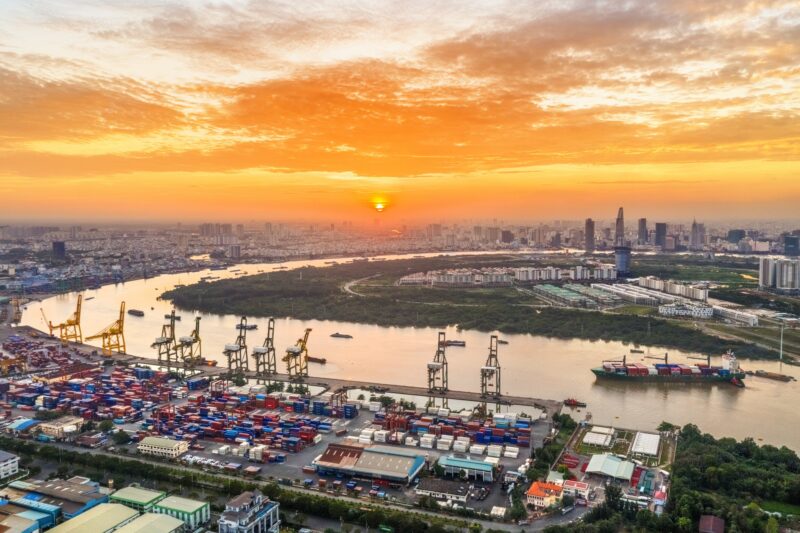 Logistics And Transportation Of Container Cargo Ship And Cargo Plane With Working Crane Bridge In Shipyard, Logistic Import Export And Transport Industry Background, Ho Chi Minh City, Vietnam